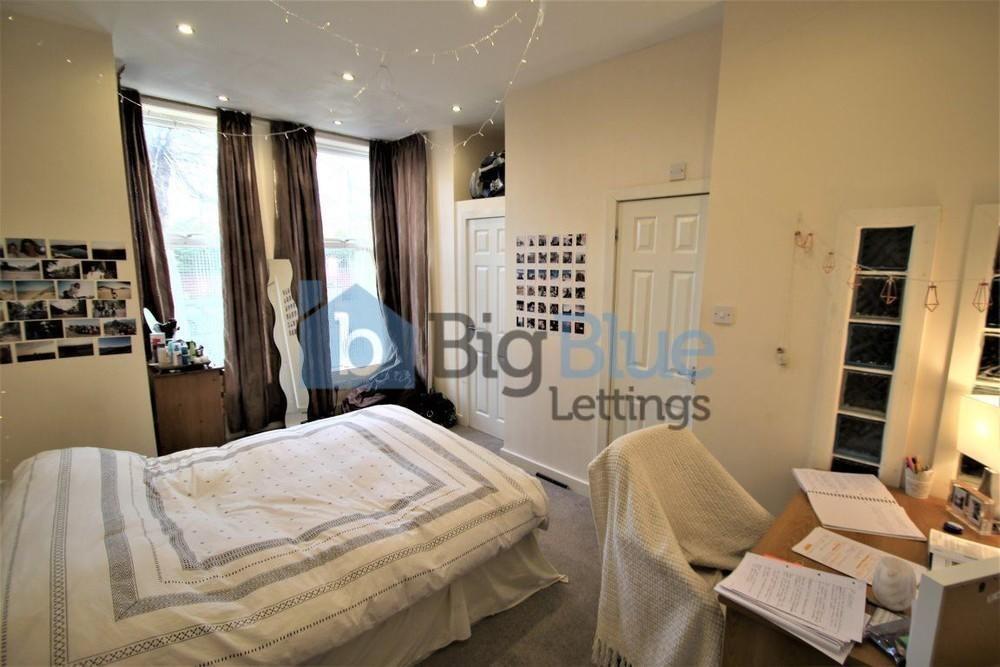 Bright and cozy double bedroom featuring a comf...