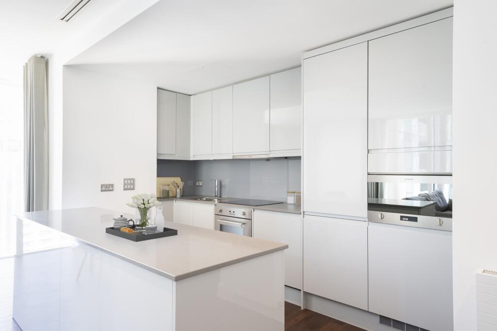 Experience luxury cooking in this sleek, modern kitchen.