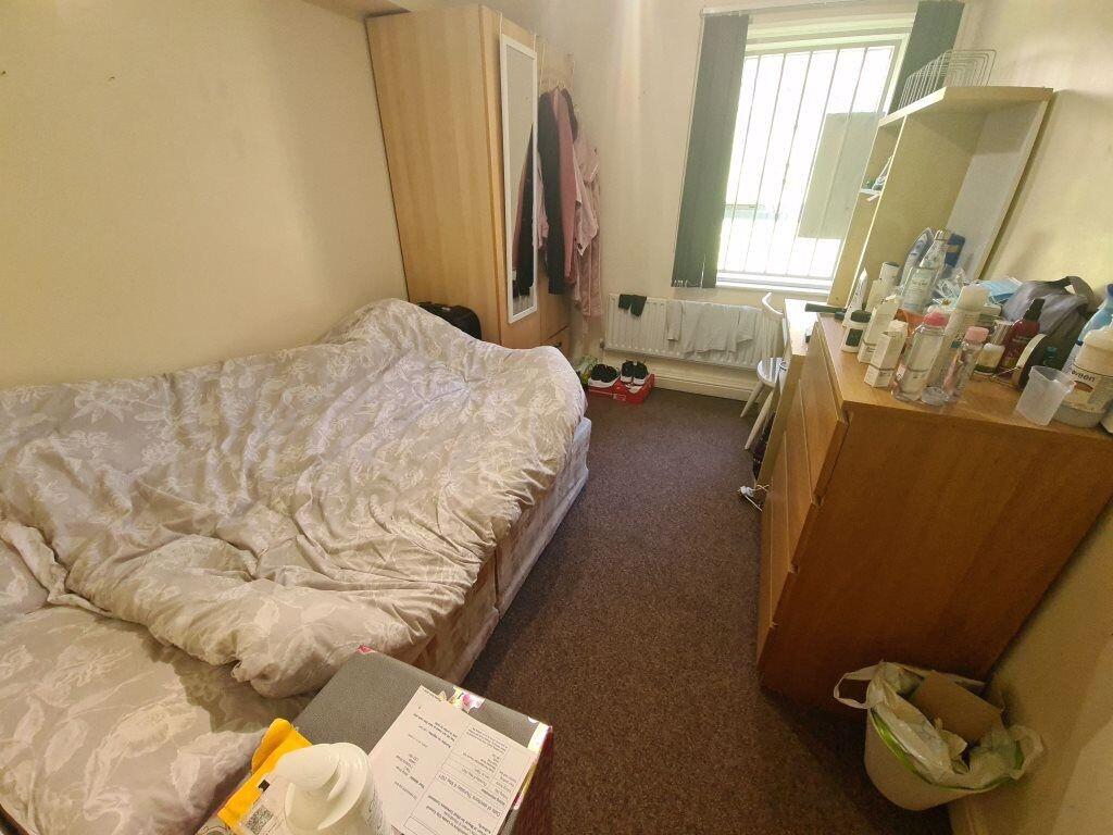 Cozy furnished bedroom with a double bed, wardr...