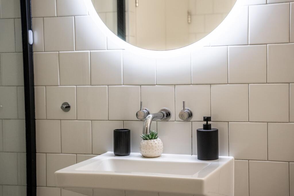 This modern bathroom features a sleek design wi...