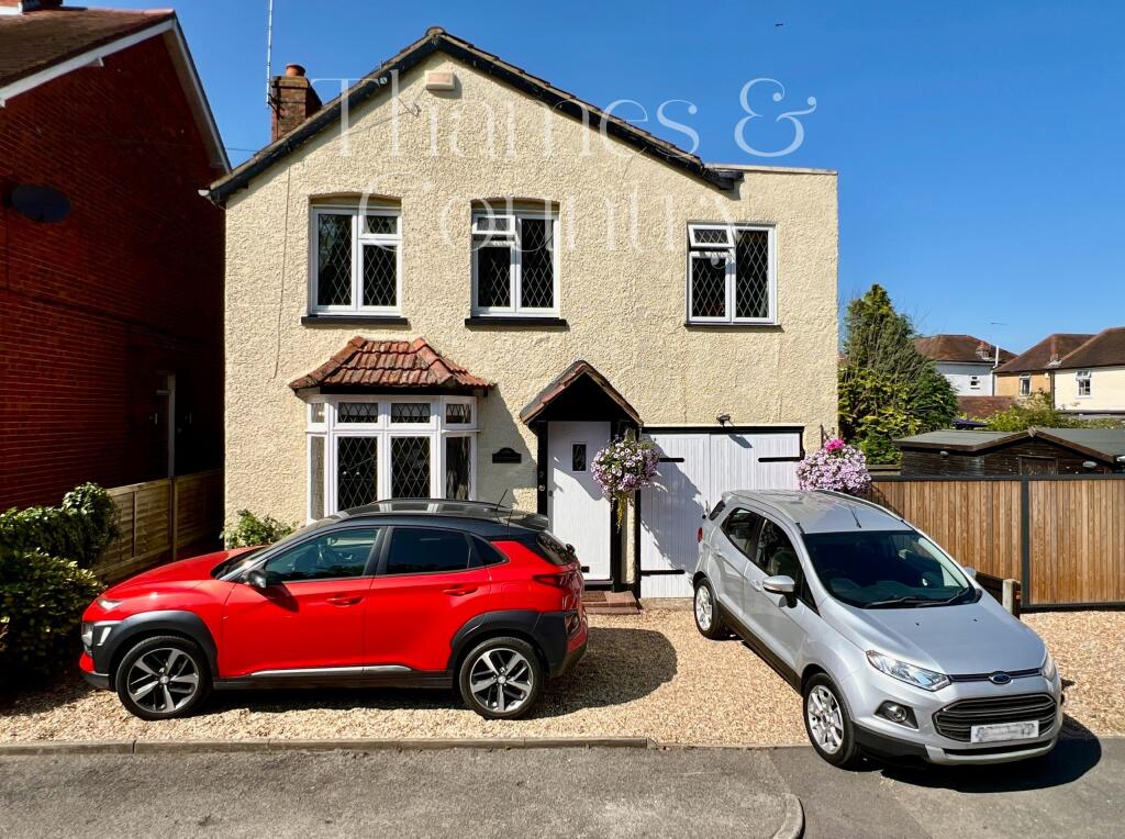 Front of house showing parking