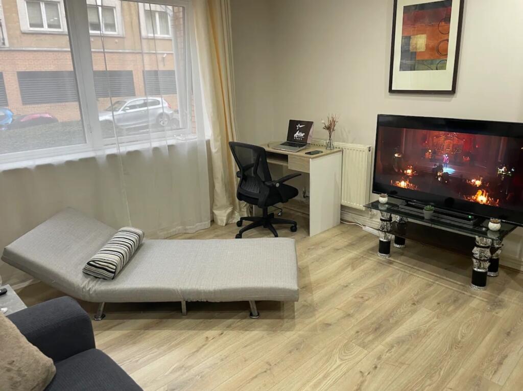 A modern living room with good natural light, f...