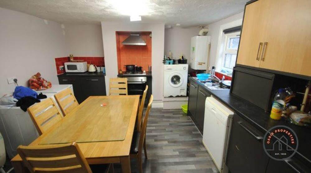 A well-equipped kitchen featuring modern applia...