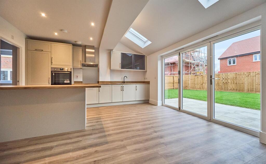 Open plan kitchen diner to rear