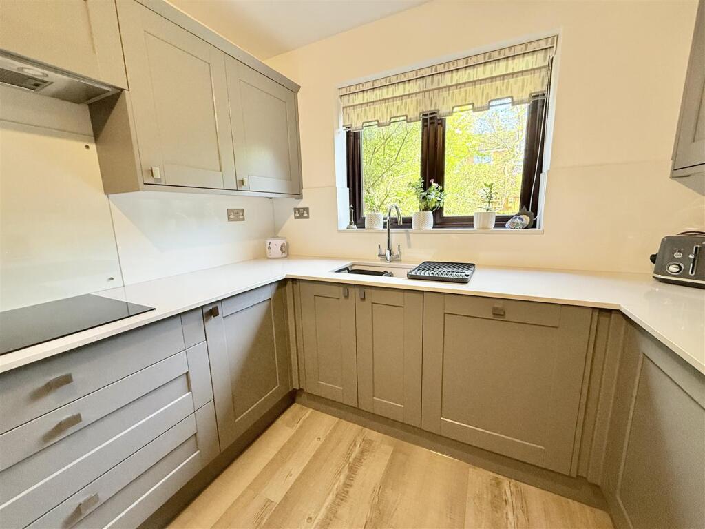Fitted Kitchen With Utility Area