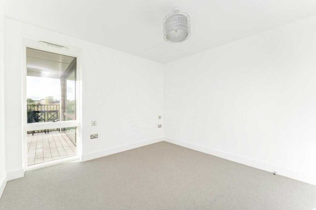 Bright and clean double bedroom featuring prist...