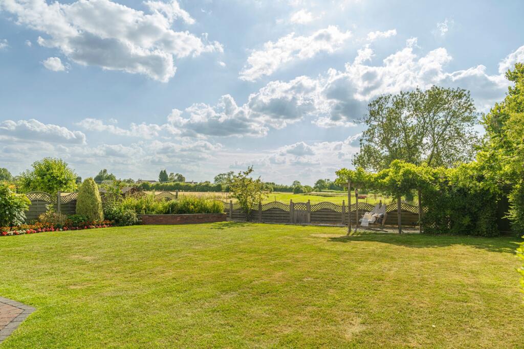 Luscious landscaping with spacious garden