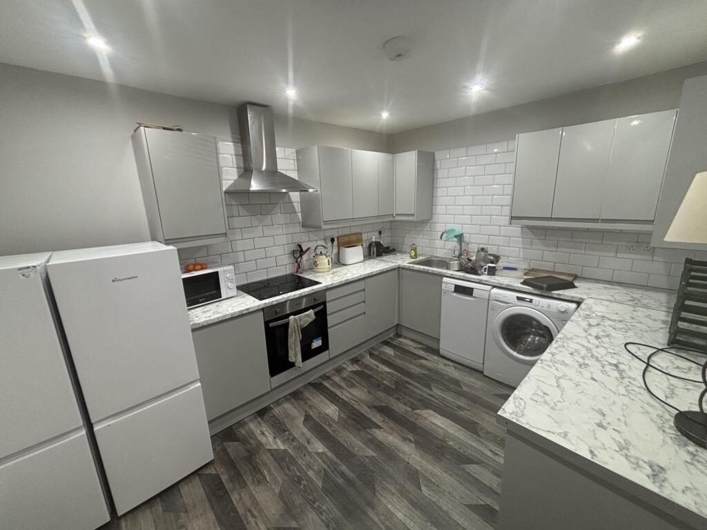Modern and spacious kitchen with bright lightin...