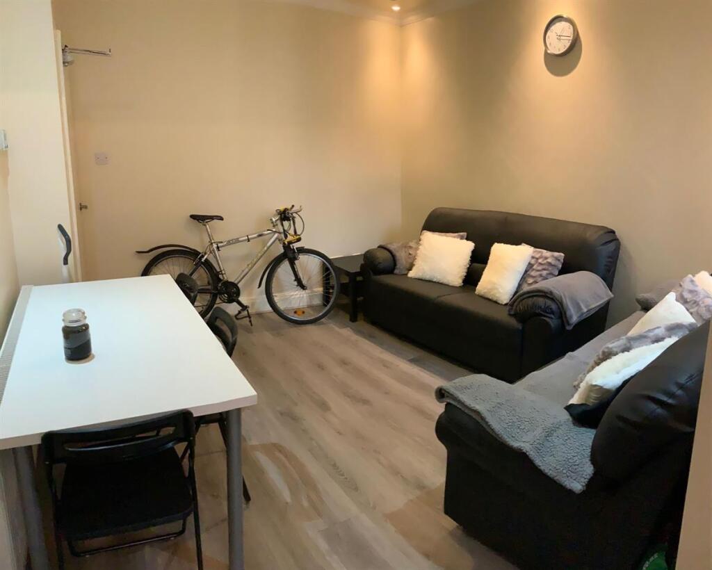 Cozy furnished living room with two sofas, mode...