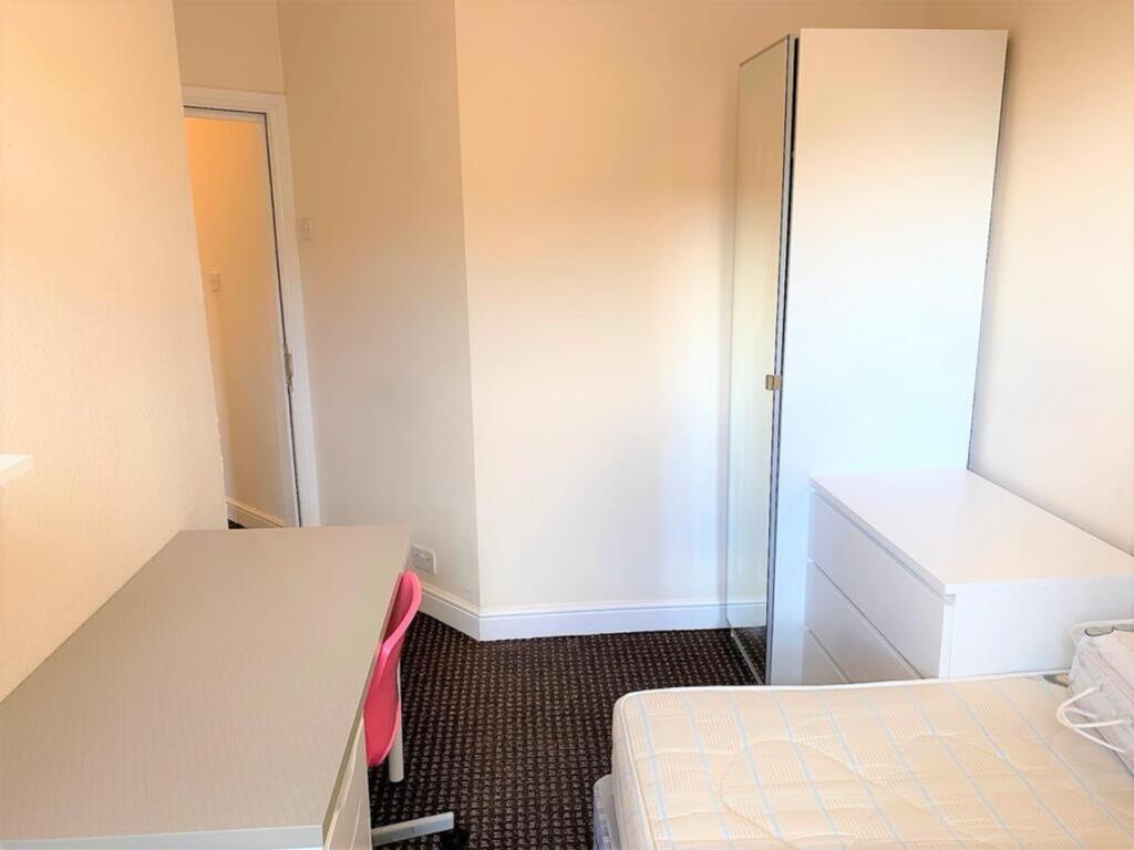 A bright and inviting double bedroom featuring ...