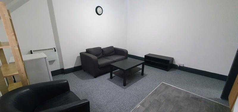 A modern, well-maintained living room featuring...