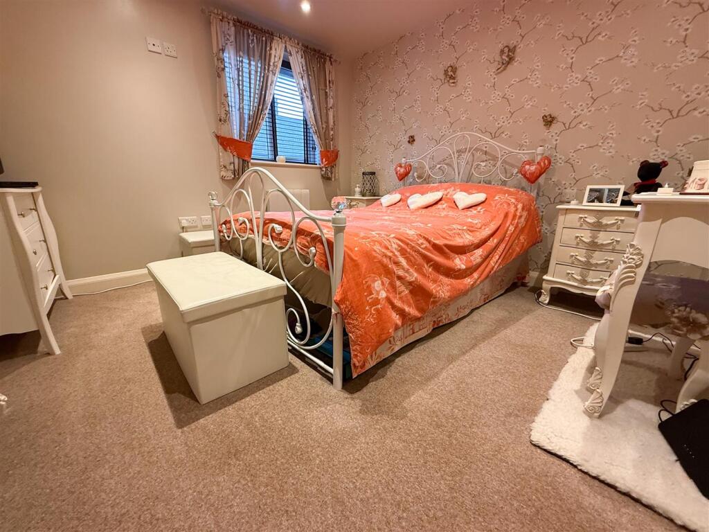 PRIMARY BEDROOM ONE
