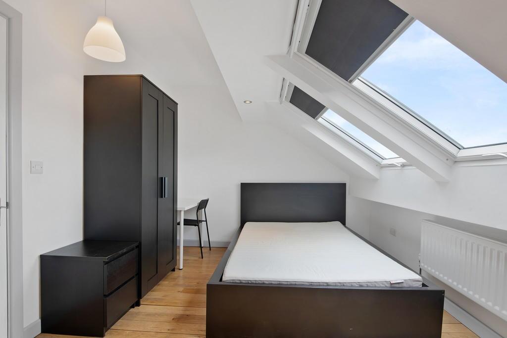 Bright and modern single bedroom featuring slee...