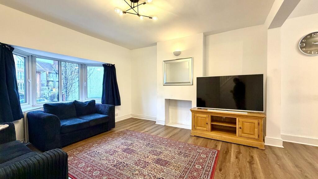 Bright, comfortably furnished living room with ...