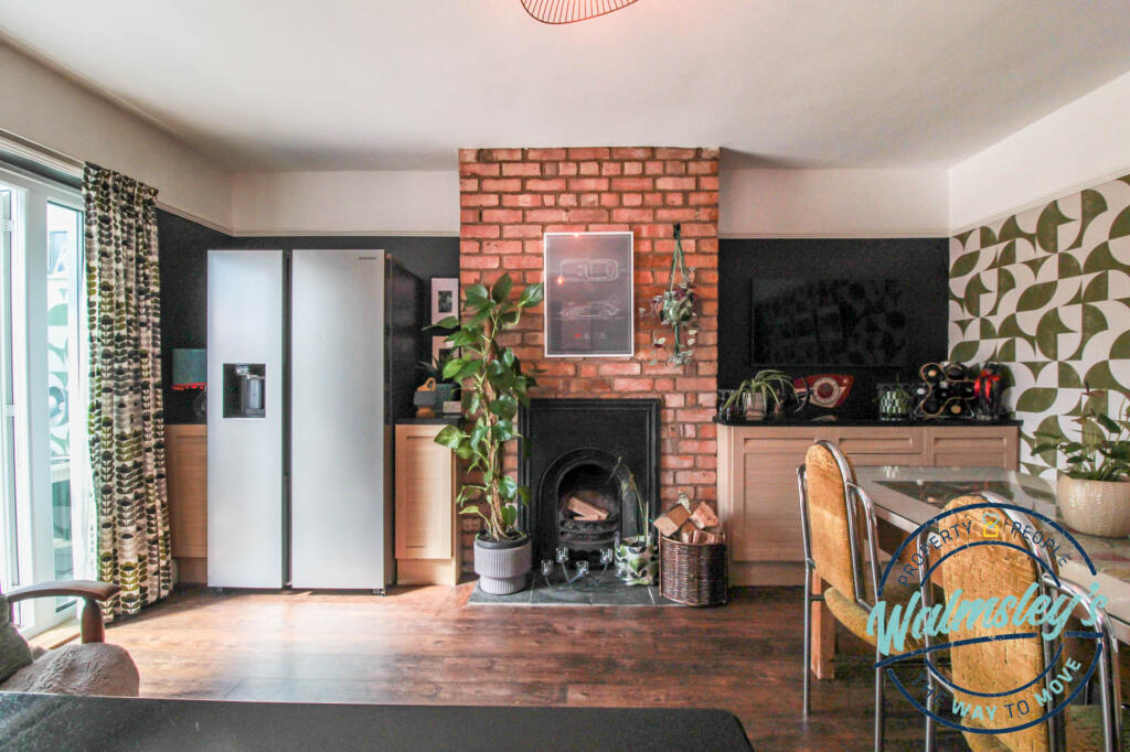 Fire place within sitting area in kitchen