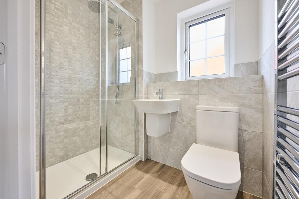 With upgraded tiling and towel rails included