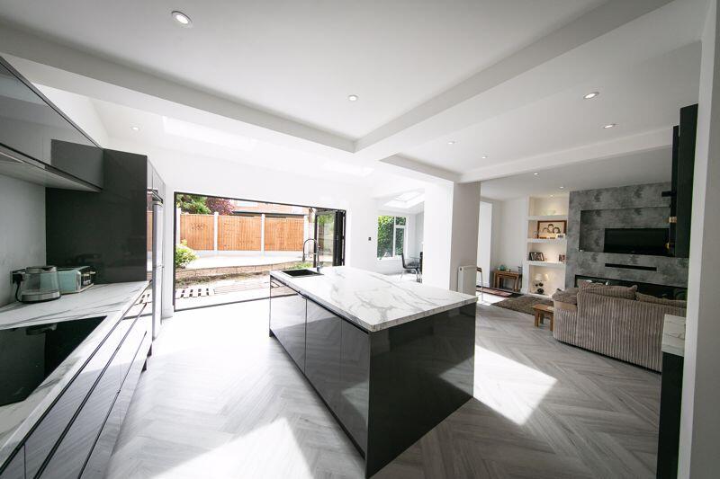 Open plan family room with bi-fold door