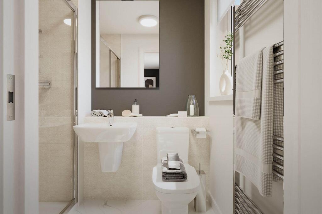 The main bedroom also hosts a private en suite shower room