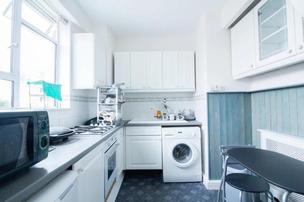 Bright and functional kitchen featuring ample n...