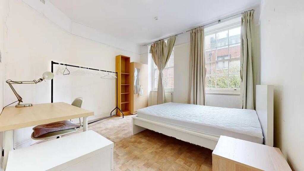 Bright and airy double bedroom featuring large ...