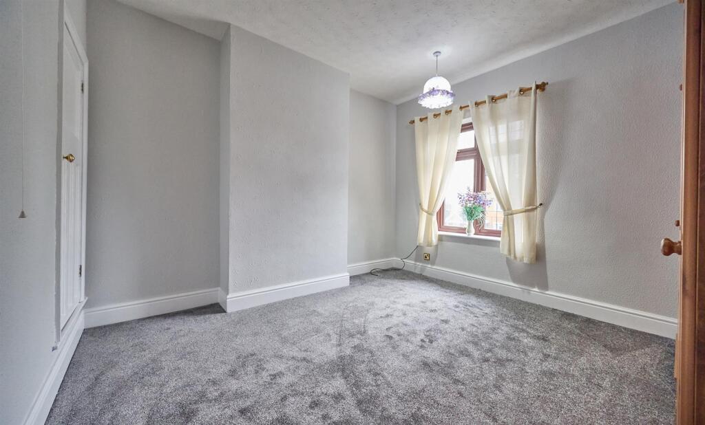 FRONT BEDROOM ONE