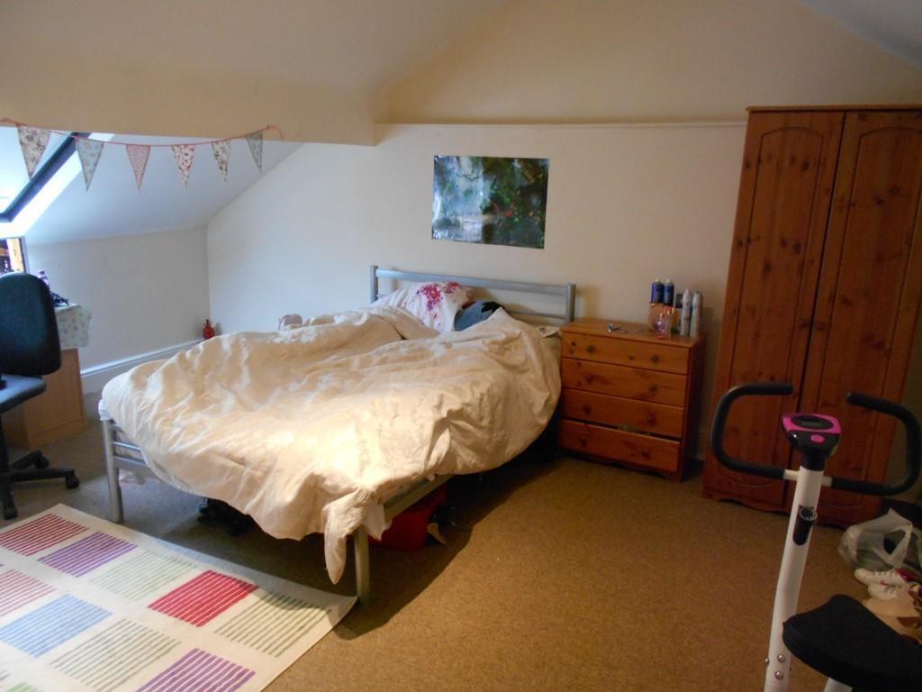A cozy double bedroom featuring a comfortable d...