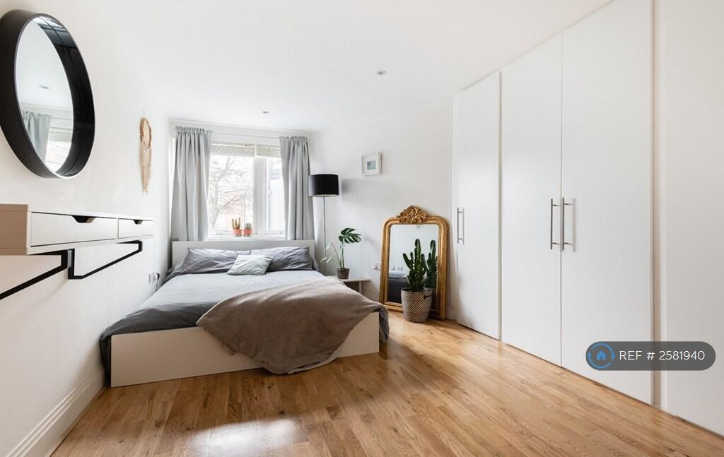 Large Bedroom With a Spacious Built-In Wardrobe