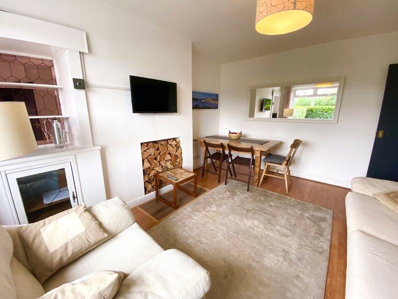This inviting living room features a cozy seati...