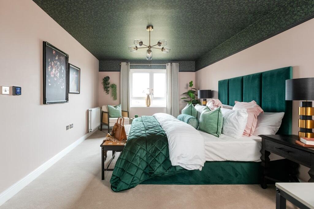 Bedroom 1 spans across the width of the home