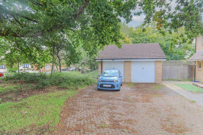 Garage with Driveway Parking