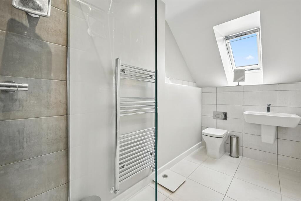 Bedroom Five en-suite - sink and WC.jpg