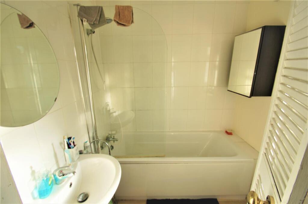 This well-maintained bathroom features a soothi...