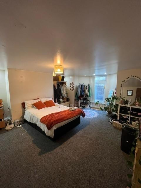 A spacious and well-maintained bedroom featurin...