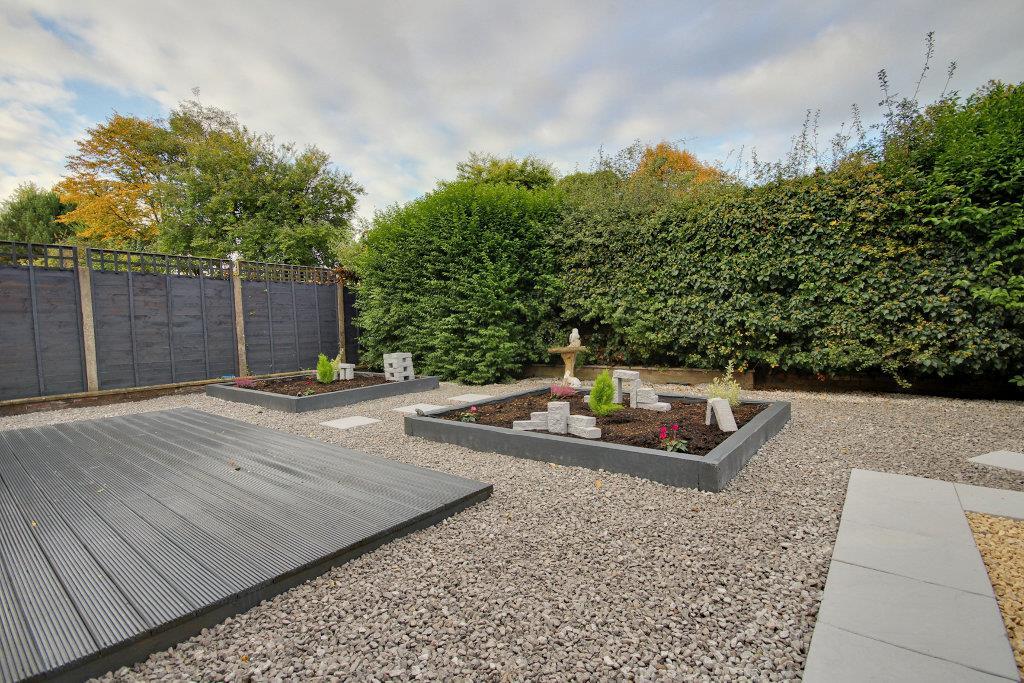 Superb low maintenance garden with garden store