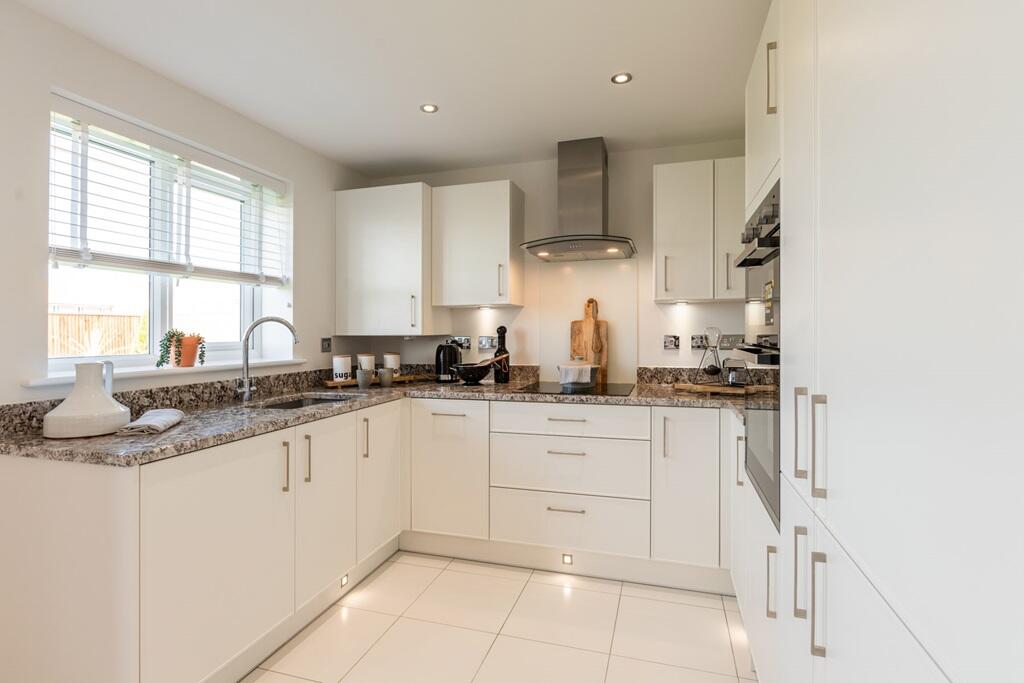 The modern kitchen benefits from ample storage