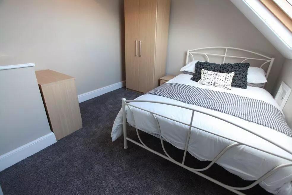 Bright and cozy double bedroom featuring a comf...