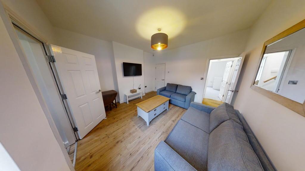 A bright and inviting living room featuring two...