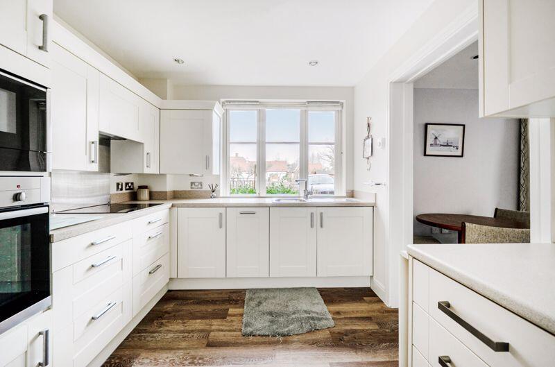 Kitchen with built-in appliances