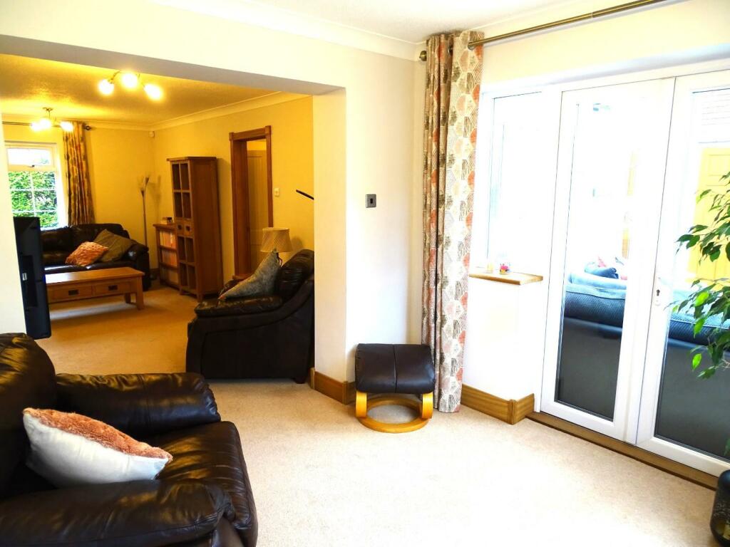 VIEW FROM SNUG/FAMILY AREA TO SITTING ROOM