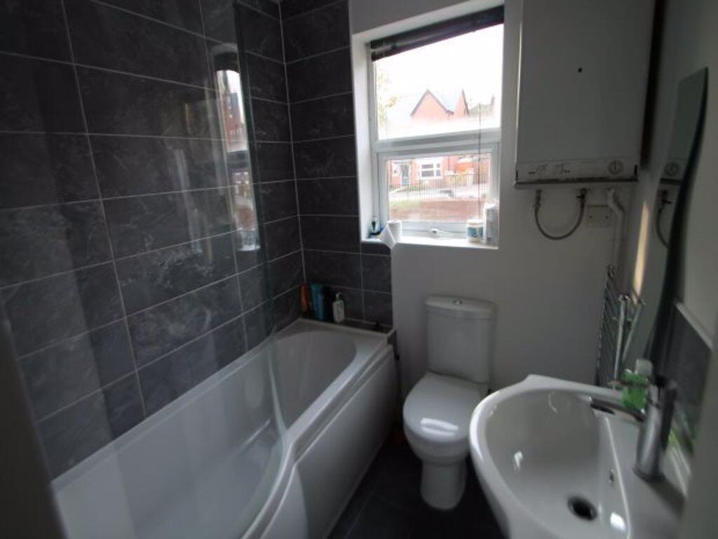 Bright, modern bathroom with a full bath and sh...