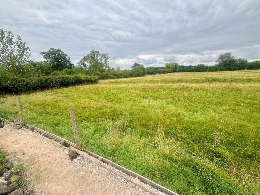 Fields to rear