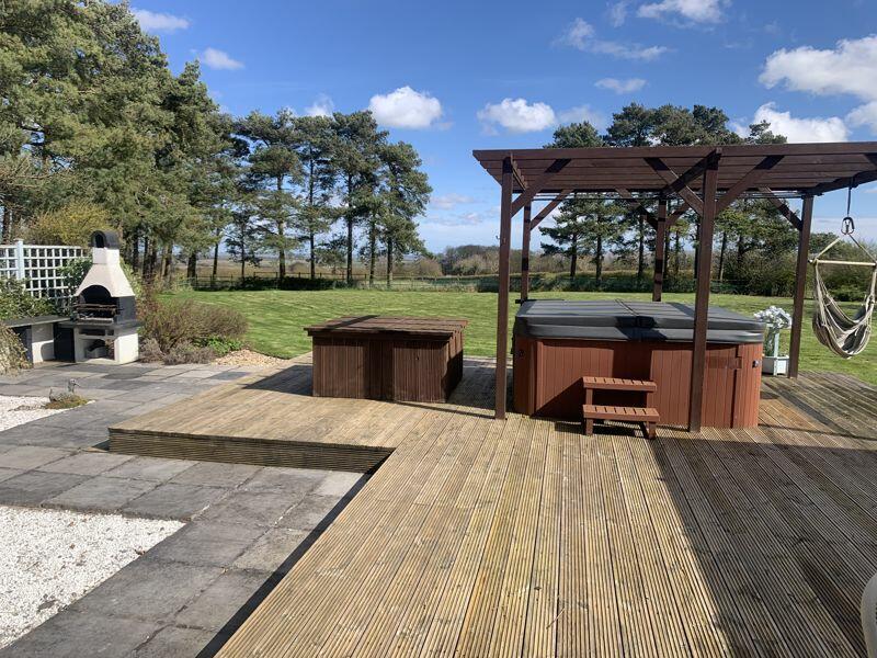Decked terrace with hot tub