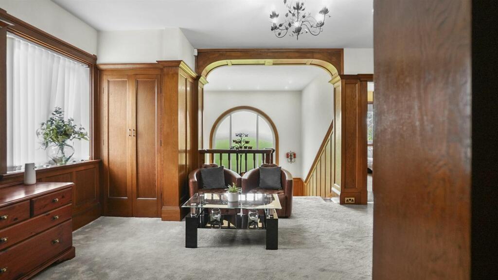 Large open landing area with impressive window