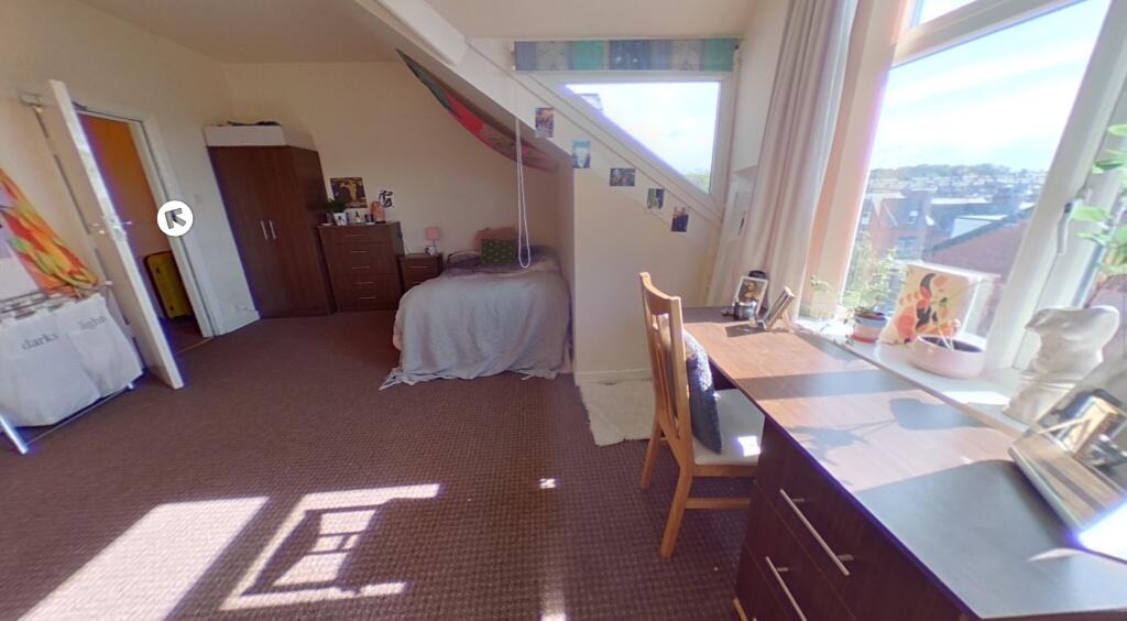 Bright and spacious master bedroom featuring a ...