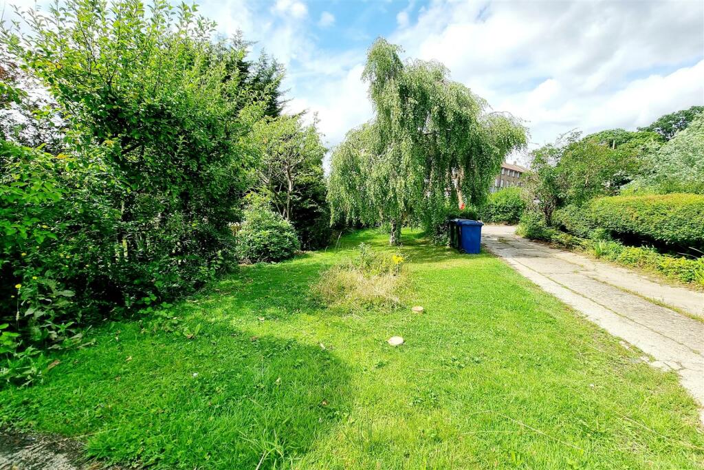 FRONT GARDEN AREA LAID TO LAWN: