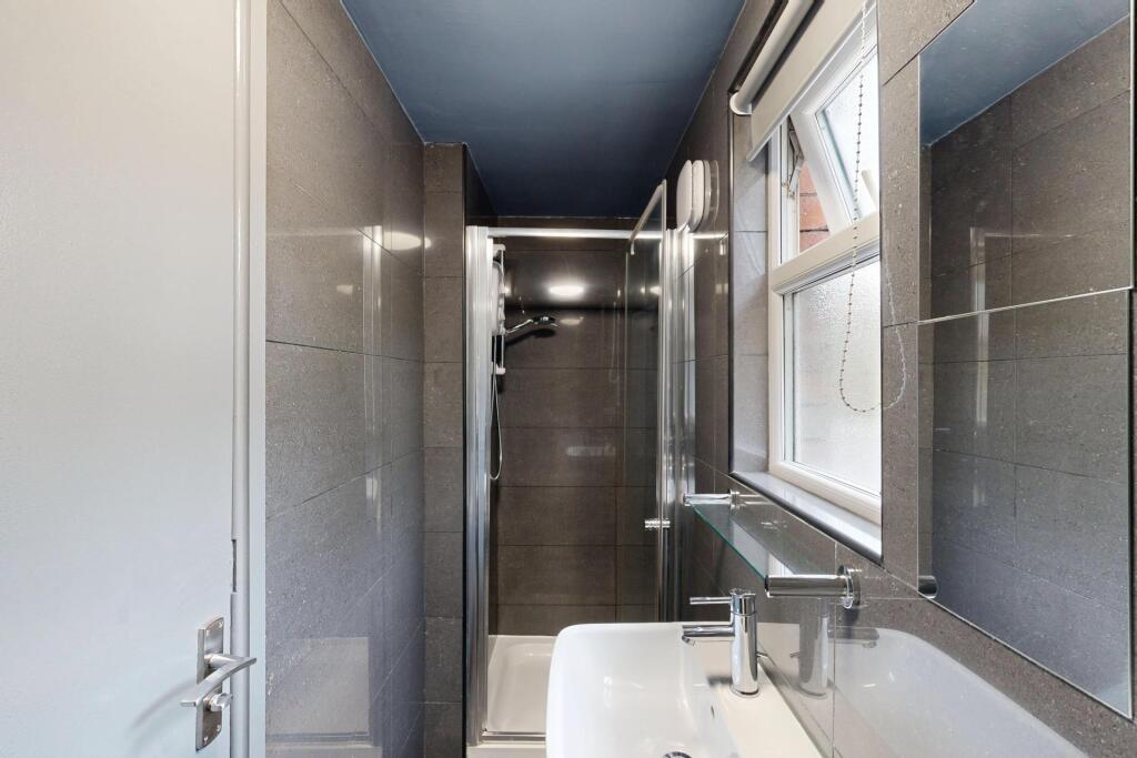 A clean and well-maintained bathroom featuring ...