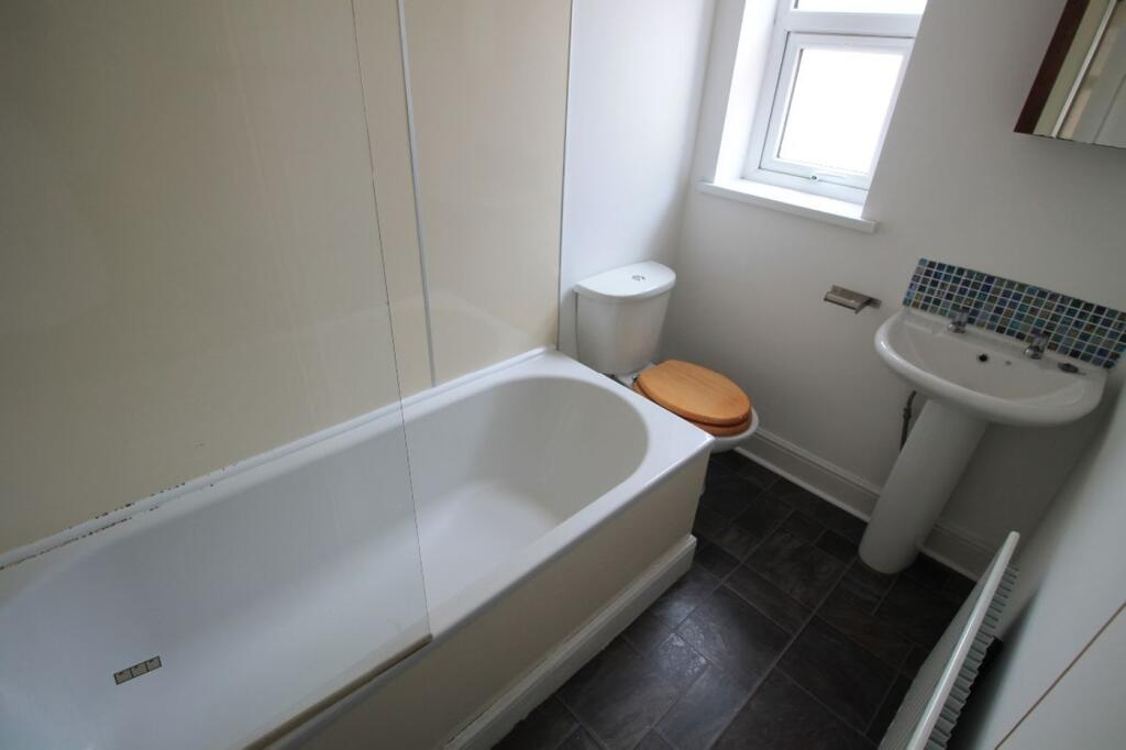 Bright and airy bathroom featuring a modern bat...