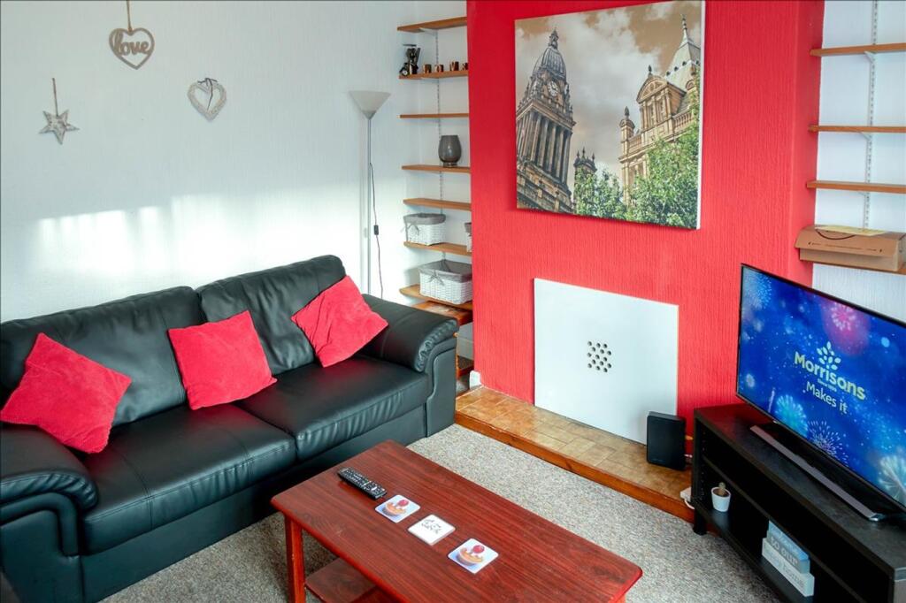 This inviting living room features a comfortabl...