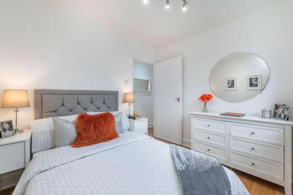 Bright and tidy double bedroom featuring a comf...