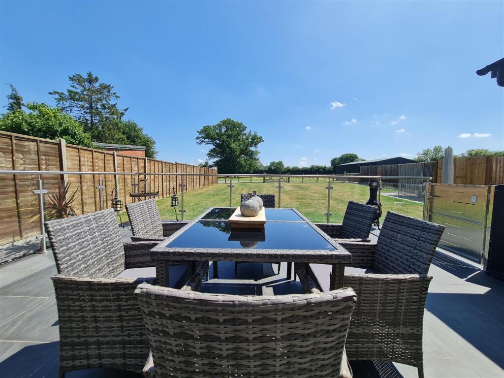 Decking, garden and view towards paddock